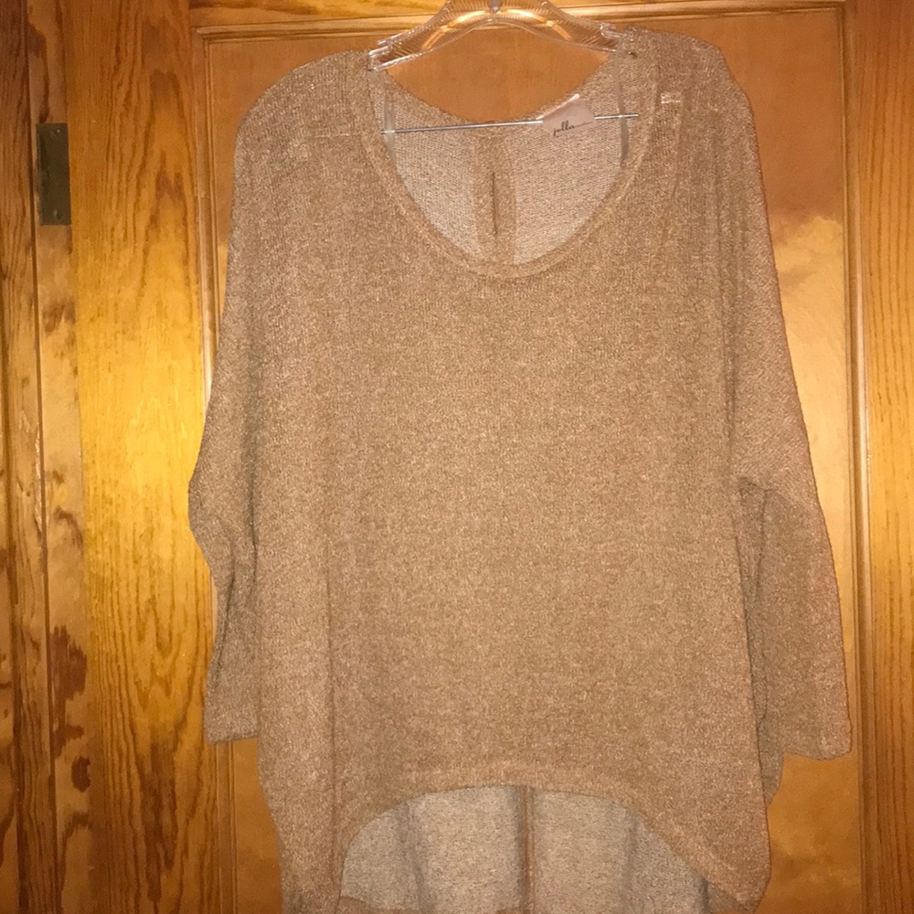 Woman’s light weight sweater.Boutique never worn